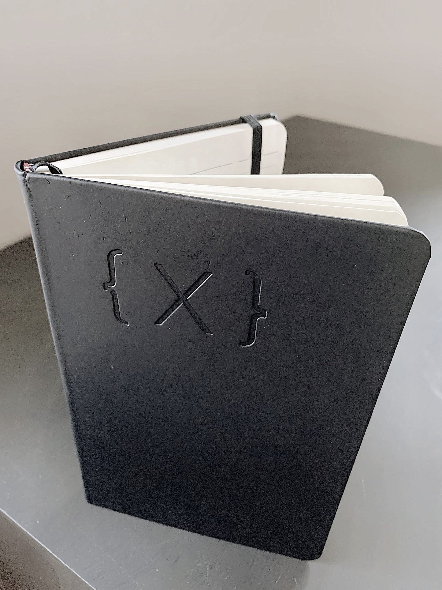 Notebook - {X} Logo